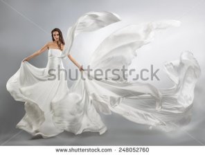flying-white-dress-flowing-fabric-248052760